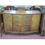 XX Century mahogany bow fronted sideboard with four central drawers, flanking cupboards on bracket