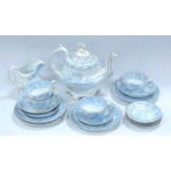 An early Victorian part tea service circa 1850 comprising of teapot, teacups and saucers, side