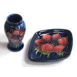 A Miniature Moorcroft Vase, painted in the 'Anemone' pattern on a blue ground, 5cm high and a