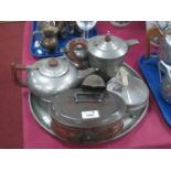 F.C. Beaten Pewter Coffee Pot with Art Deco Decoration, similar three-piece tea service and tray,