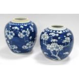 Two Chinese ginger jars both painted with blue and white flower patterns. (2) One jar has been