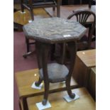 Japanese Plant Table, carved with monkeys in naturalistic setting to octagonal top and undershelf on