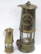 Eccles Miners Lamp, together with a miniature miners lamp, (2).