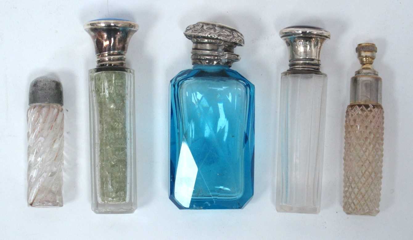 A Late XIX Century Scent Bottle, the faceted blue glass body with white metal cover, 8cm high, a