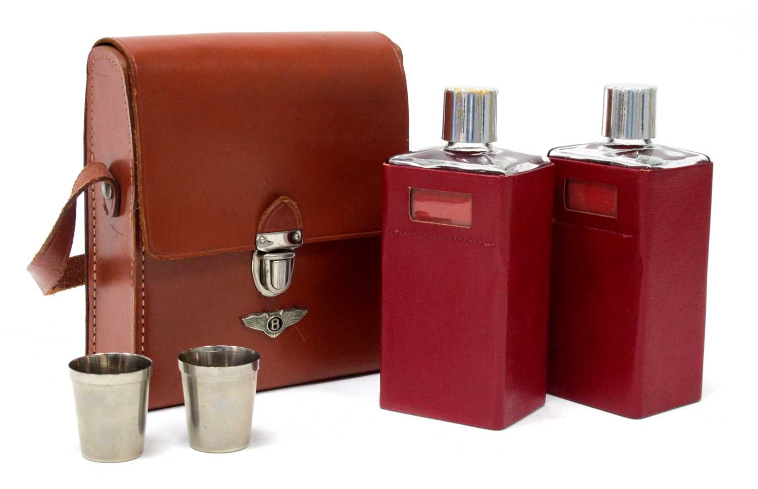 An Art Deco Bentley hide motoring drinks case containing two glass decanters with two plated - Image 2 of 3