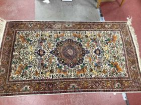XX Century Silk Middle Eastern Rug, with central motif surrounded by hunting scenes and animals,