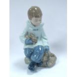 Nao (Lladro) Porcelain Figure of a Boy with His Best Friend, a cute little bunny, 16cm high.