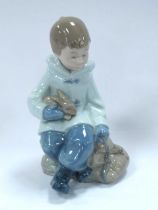 Nao (Lladro) Porcelain Figure of a Boy with His Best Friend, a cute little bunny, 16cm high.