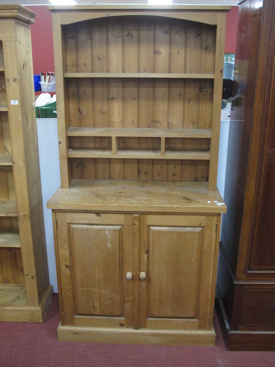 A Pine Dresser, with three small drawers to rack, inner shelves to two door base, 91.5cm wide.