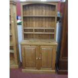 A Pine Dresser, with three small drawers to rack, inner shelves to two door base, 91.5cm wide.