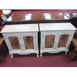 A Pair of White Painted Shabby Chic Cabinets, with glazed doors and shaped apron on cabriole legs,