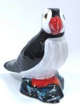 Anita Harris Model of a Puffin, in reactive glazes and enamels, gold signed, 13.5cm high.