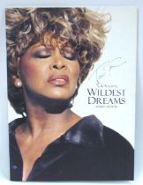 Tina Turner. Autograph, blue pen signed (unverified) on the cover of a World Tour 96 programme.