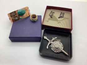 A Scottish Hallmarked Silver Sword and Shield Brooch, together with a hand made cuff bangle, oval