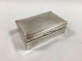 Military Interest; A Hallmarked Silver Cigarette Box, London 1917, of plain rectangular form, the