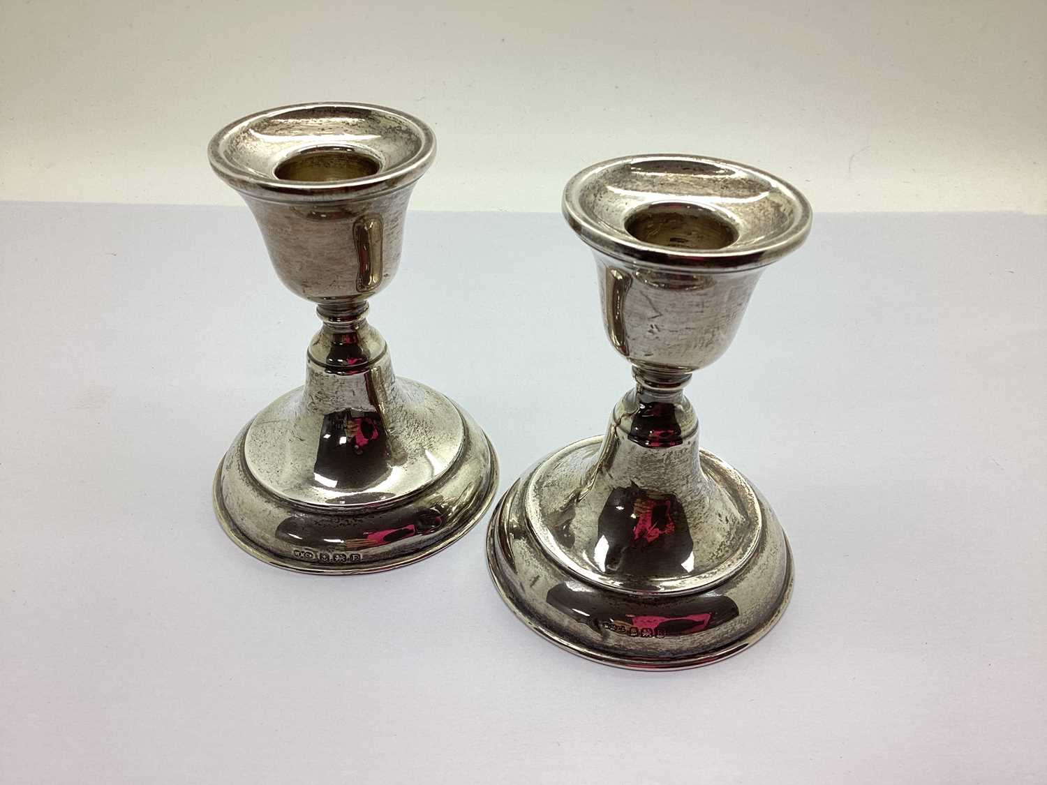 A Matched Pair of Hallmarked Silver Candlesticks, (bases weighted) 9cm high (dents). (2) - Image 2 of 2