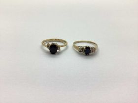 Two 9ct Gold Dress Rings, oval claw set to the centre (one stone missing) (finger size N, P). (2)