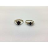 Two 9ct Gold Dress Rings, oval claw set to the centre (one stone missing) (finger size N, P). (2)