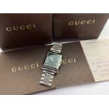 Gucci; A Modern Gent's Wristwatch, ref: 138.4, the signed rectangular dial with line markers, centre