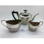 A Hallmarked Silver Three Piece Bachelors Tea Set, JR, Sheffield 1918, each of oval semi reeded