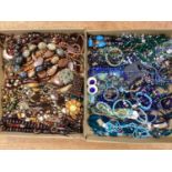 A Mixed Lot of Assorted Costume Jewellery, in hues of brown, blue and green :- Two Trays
