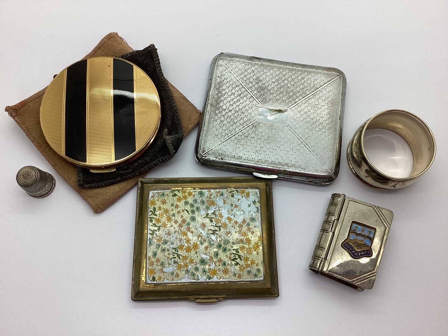 Powder Compacts, a hallmarked silver napkin ring, Southport vintage souvenir book vesta case,