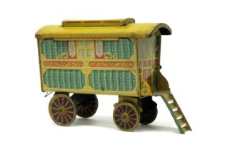A Mid XX Century Tinplate Gypsy Caravan by Chad Valley, complete with tun hook and hinged roof.