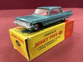 Dinky Toys No 147 Cadillac 62 Metallic Type Green, overall very good/plus, boxed, rubbing/