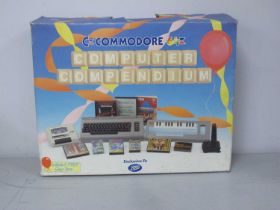 Retro Technology: A Commodore 64 Home Computer. Accessories include Data Recorder, Music Maker,
