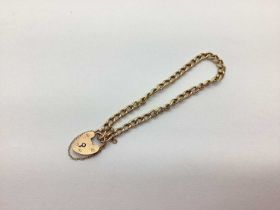 A Rose Colour Curb Link Bracelet, to heart shape padlock style clasp. 5.3grams in weight, first link