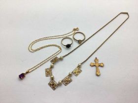 A 9ct Gold Single Stone Pendant, teardrop claw set, on a 9ct gold chain; a cross pendant stamped "