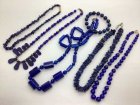 A Selection of Modern Polished Hardstone Jewellery, in hues of blue, including a long alternate bead