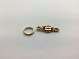 A Victorian Bar Brooch, of shaped design, stamped "9ct" (steel pin); together with a band ring (