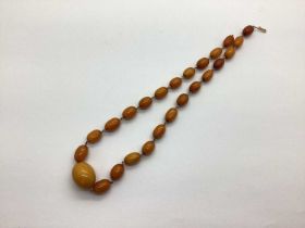 An Amber Coloured Graduated Bead Necklace, (incomplete).