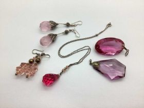 A Small Collection of Faceted Glass Jewellery, in hues of pink, including a pear shaped pendant,