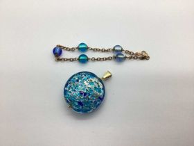 A 9ct Gold Hinge Bail Avventurina Glass Pendant, of circular form, in hues of blue, gold and silver,