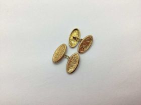 A Pair of 9ct Gold Cufflinks, the foliate engraved oval panels on chain connections (4grams).