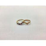 A 9ct Gold Stone Set Wishbone Ring, alternate claw set stones (finger size K), a 9ct gold plain