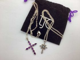 A Cross Pendant, cabochon set, stamped "925", on flat link curb chain, stamped "STG 925", together