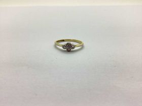 A Dainty Antique Four Stone Ring, collet set, stamped "18ct Plat" (finger size M). The ring weighs