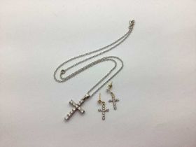 A Modern 9ct White Gold Cross Pendant, claw set, on a 9ct white gold chain; together with a pair