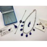 A Modern Hallmarked Hardstone Set Necklace, of drop design, the stones alternatley shaped, to T-