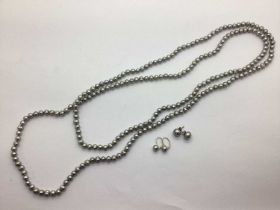 Flapper Length Freshwater Pearl Bead Necklace, together with a pair of button pearl earrings, to