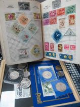 Schoolboy Stamp Album, First Man on Moon stamps montage, one pound note, coinage.