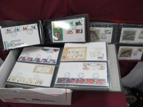 Stamps; Four albums containing over 200 Great Britain Royal Mail and Benham First Day Covers,