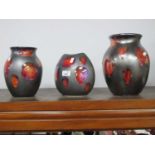 Poole Pottery Black Lustre Ovoid Shaped Vase, with random red splash motifs, 24cm high, two others