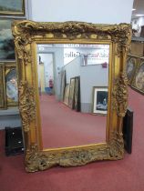 XIX Century Style Gilt Rectangular Shaped Wall Mirror, with C scroll decoration, bevelled glass, 122
