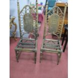 A Pair of Indonesian Bamboo Chairs, with caned back panels, on turned legs.