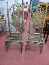 A Pair of Indonesian Bamboo Chairs, with caned back panels, on turned legs.