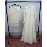 A Circa 1950'S Wedding Dress, the cream damask fitted bodice with centre front button fastening